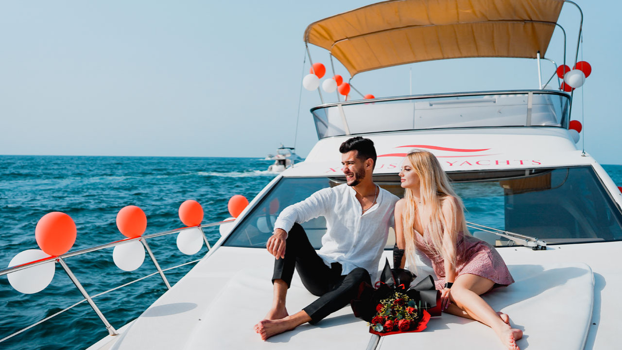Yacht proposal setup in Dubai — rose petals, candles and champagne